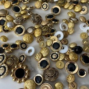 Gold buttons 30 of them.   Some are Versace (I think)